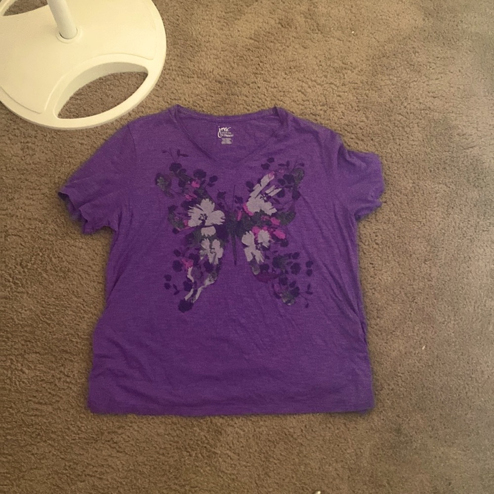 A cute purple y2k top, with a butterfly in the middle. It is a size 18-20.
